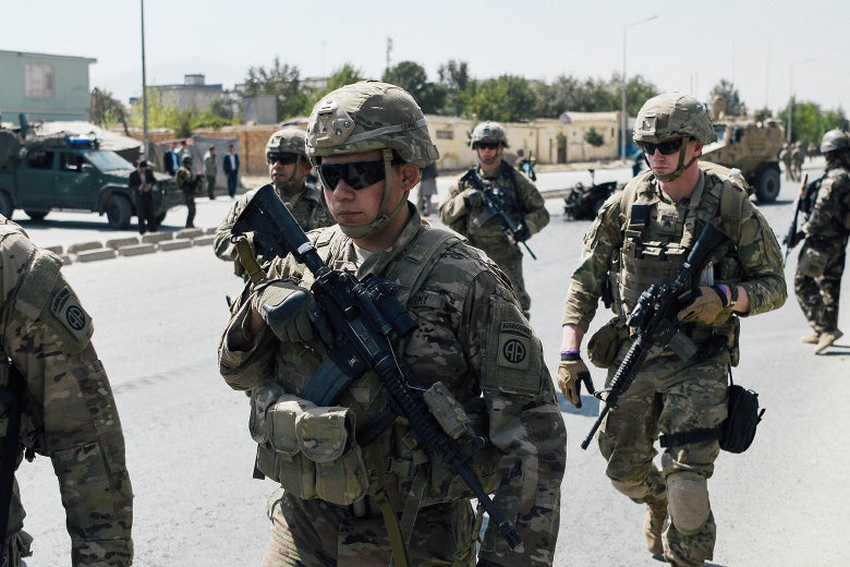 U.S. soldiers walk down a road in Kabul.